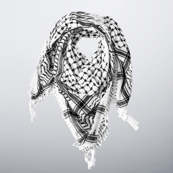 Black and white Palestinian keffiyeh with tassels, folded in a triangle.