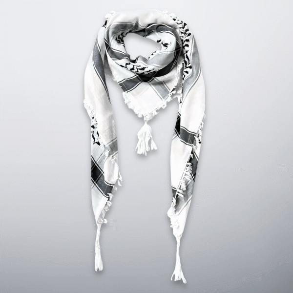 Black and white Palestinian keffiyeh with tassels, folded in a triangle.
