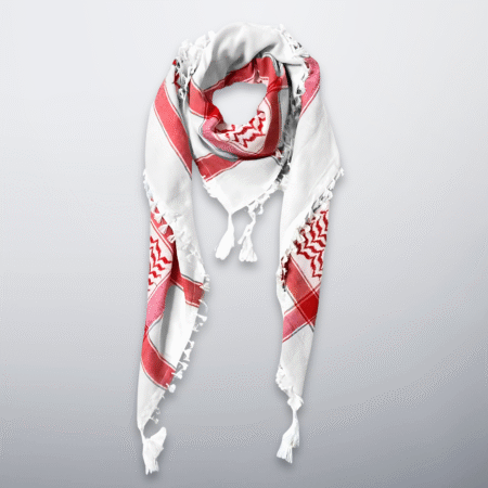 Red and white Palestinian keffiyeh with tassels, styled in a soft loop.