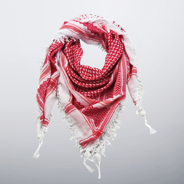 Red and white Palestinian keffiyeh with tassels, styled in a soft loop.