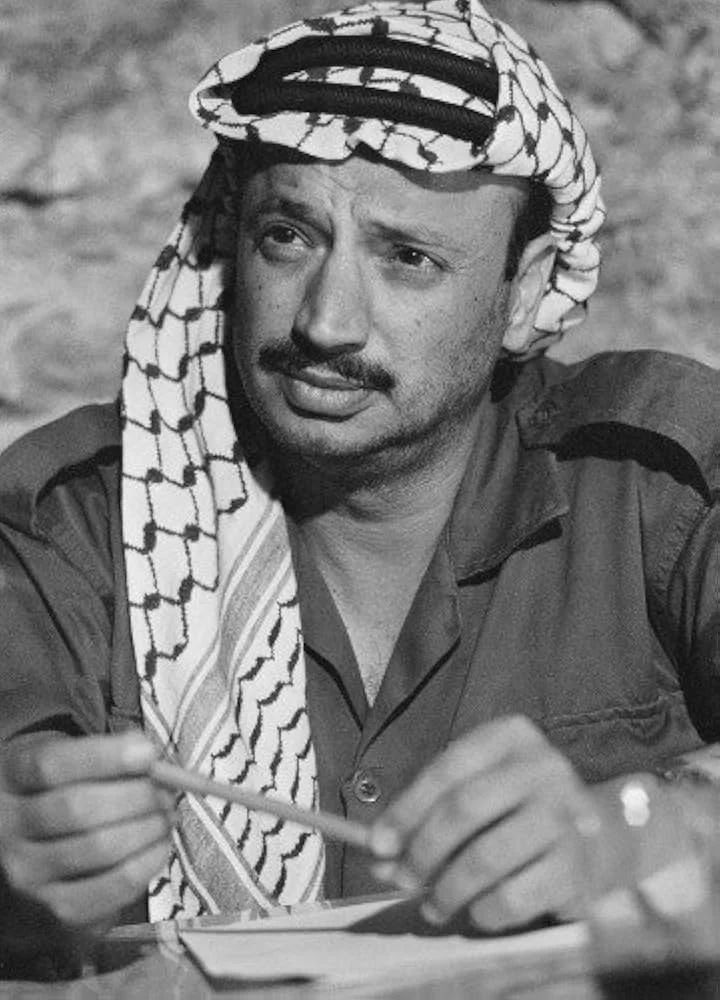 Yasser Arafat wearing a keffiyeh.