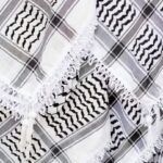 closeup of multiple black and white keffiyehs