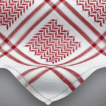 Close up of a red keffiyeh pattern on white fabric