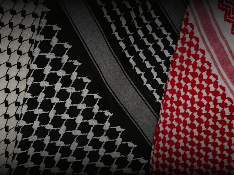 Authentic keffiyeh Palestinian scarf in traditional black and red patterns