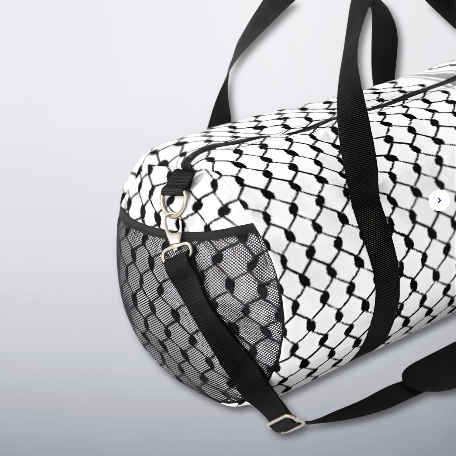 Side view of keffiyeh duffel bag showing mesh pocket and metal clips